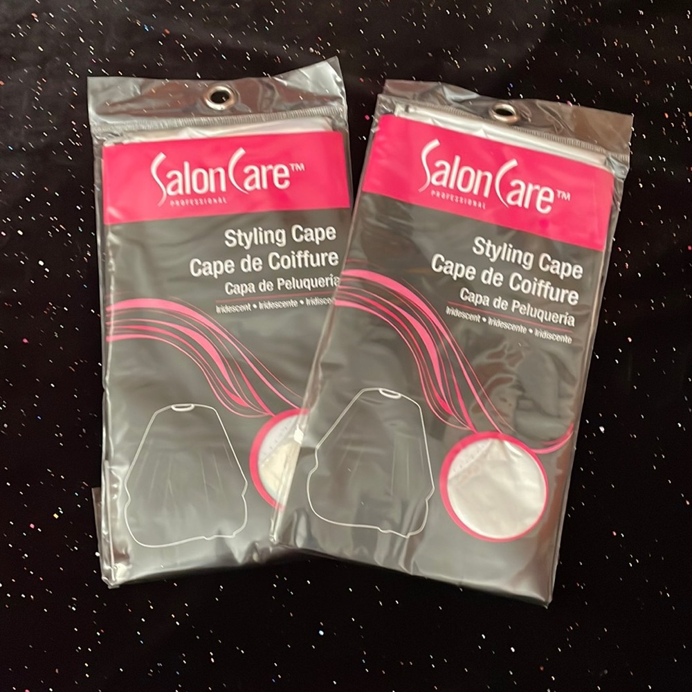 2 silver brand new styling capes!